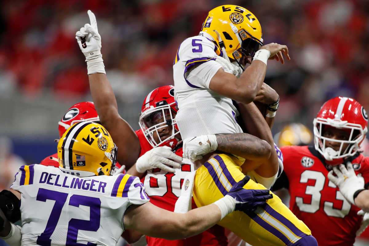 Jalen Carter Lifts Jayden Daniels / Credit UGAA/Tony Walsh